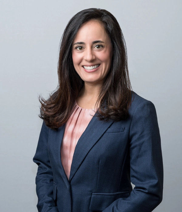 Head shot of Michelle Schwerin with a soft grey background.