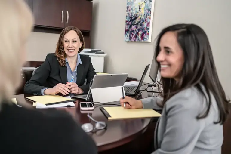 lawyers smiling at client