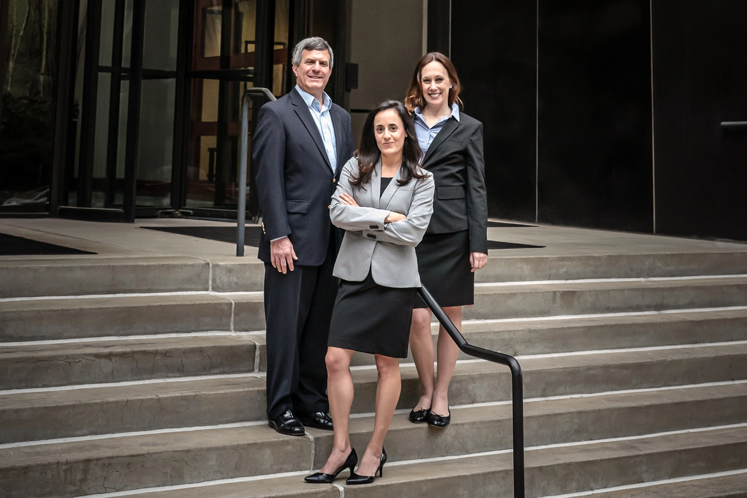 NSB Lawyers standing on law firm steps