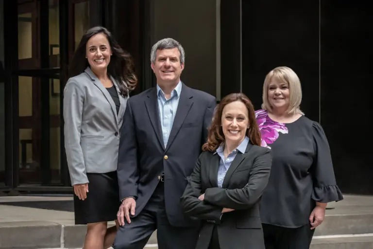 NSB team standing in front of their office.